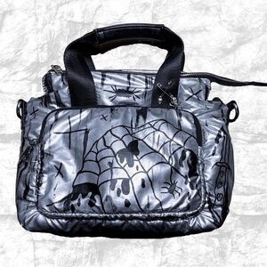 Black and silver bag with grunge designs and charms. New!
